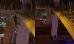 Köprüden atlayan kadını polisler havada yakaladı
